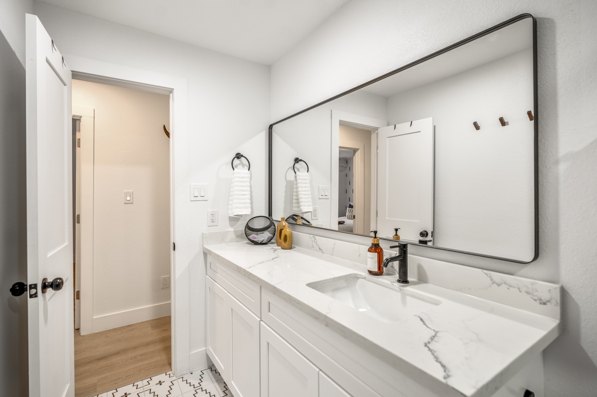 9619 Chatfield Street Houston, TX 77025 - Photo 33 of 44 a bathroom with a sink and a mirror