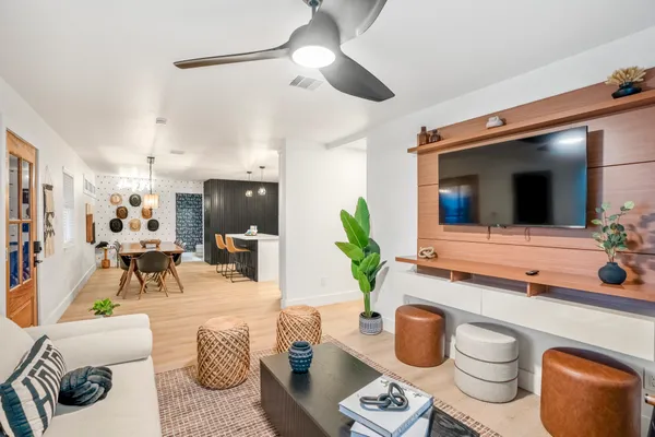 a living room with furniture and a flat screen tv