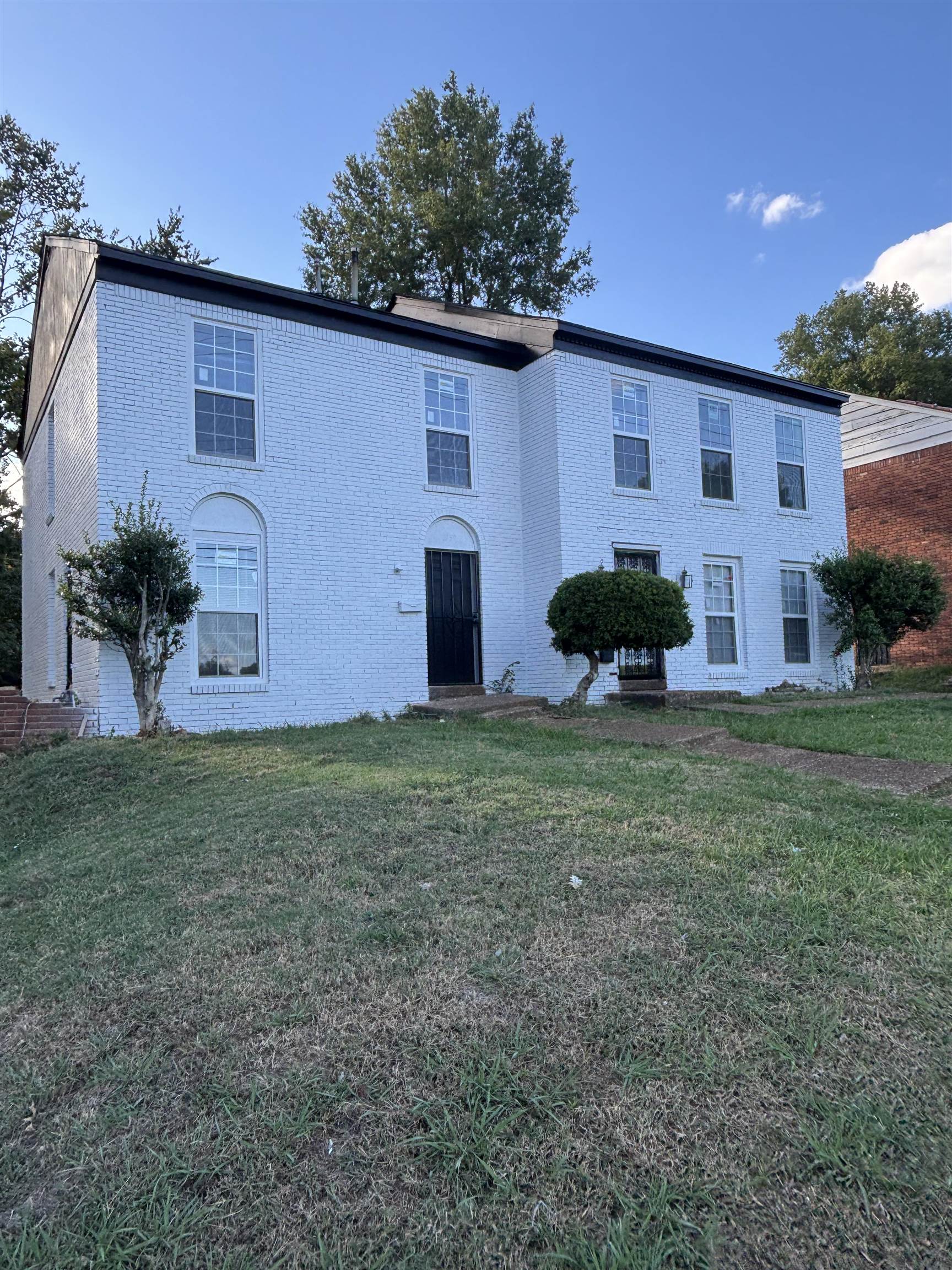 1157 Prescott Road Memphis, TN 38111 - Photo 1 of 31 front view of a house with a yard