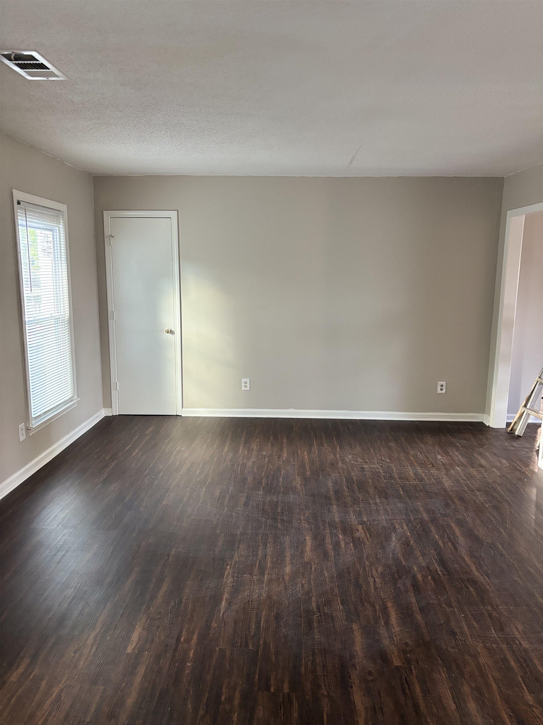 1157 Prescott Road Memphis, TN 38111 - Photo 31 of 31 an empty room with wooden floor and windows
