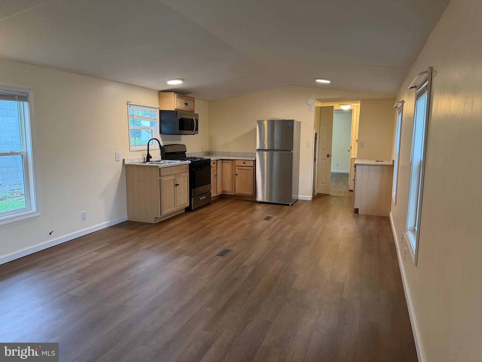 1104 West Elm Avenue Hanover, PA 17331 - Photo 5 of 13 a kitchen with stainless steel appliances a refrigerator and a stove top oven