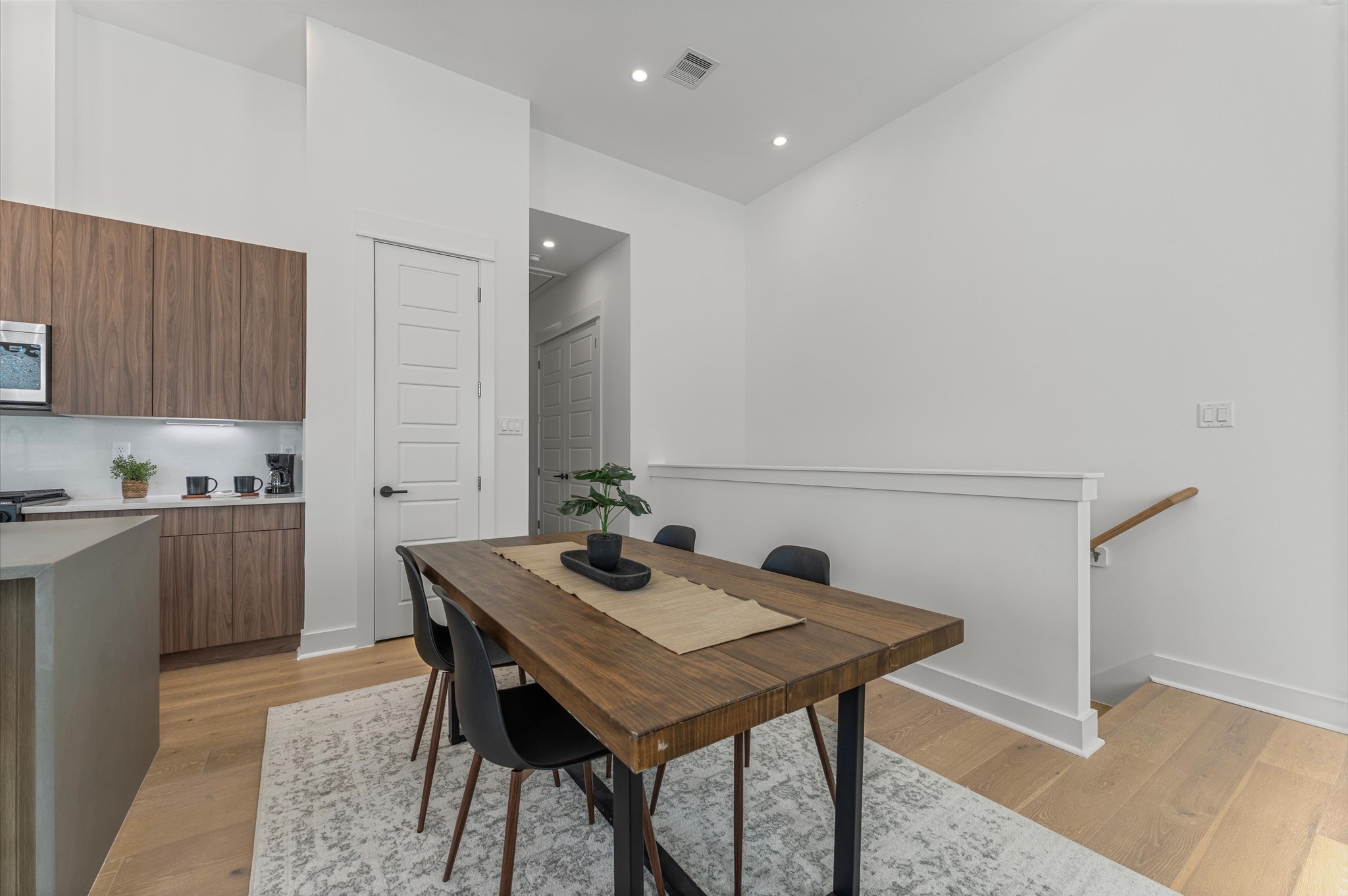2424 Freeman Street Houston, TX 77009 - Photo 18 of 43 The dining area, part of the open-concept living, dining, and kitchen on the second floor, offers ample space for a large table, making it perfect for family meals or entertaining friends, while seamlessly flowing with the bright, airy atmosphere of the surrounding living space.