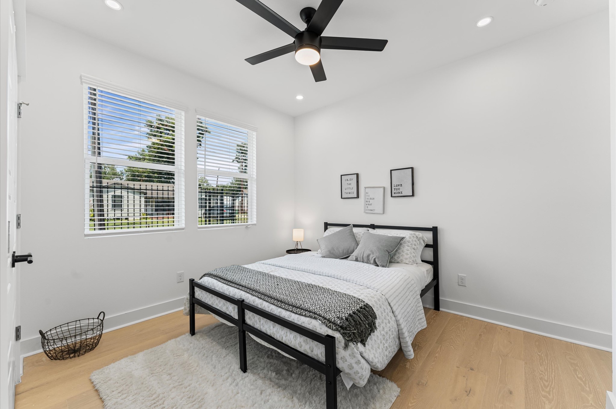 2424 Freeman Street Houston, TX 77009 - Photo 5 of 43 Secondary bedroom on the first floor with an ensuite bathroom, offering convenience, privacy, and a perfect layout for family members or guests.