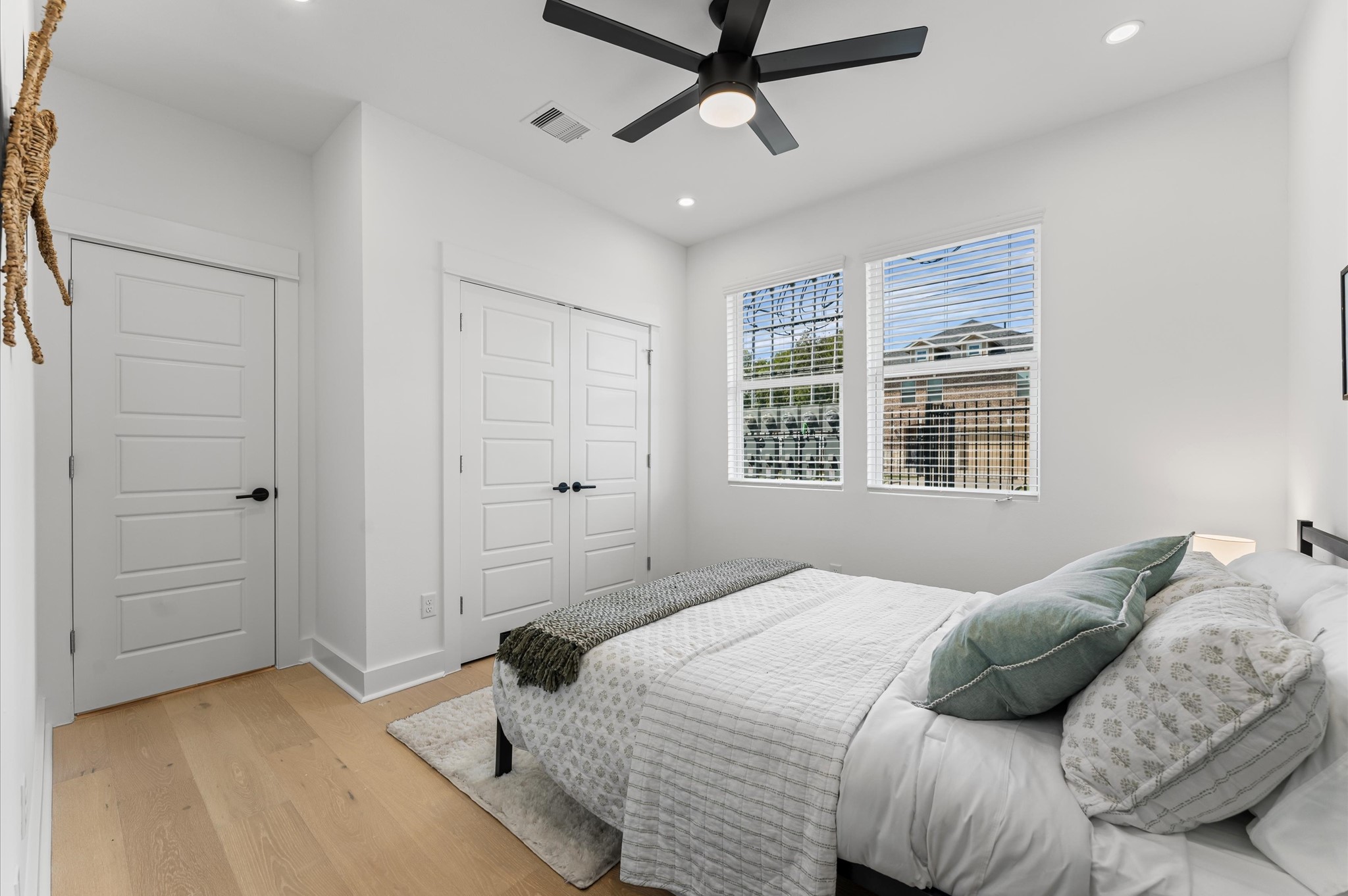 2424 Freeman Street Houston, TX 77009 - Photo 6 of 43 Secondary bedroom on the first floor with an ensuite bathroom, offering convenience, privacy, and a perfect layout for family members or guests.