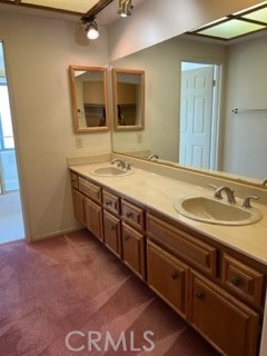 5650 Los Robles La Verne, CA 91750 - Photo 15 of 20 a bathroom with a sink double vanity and a mirror