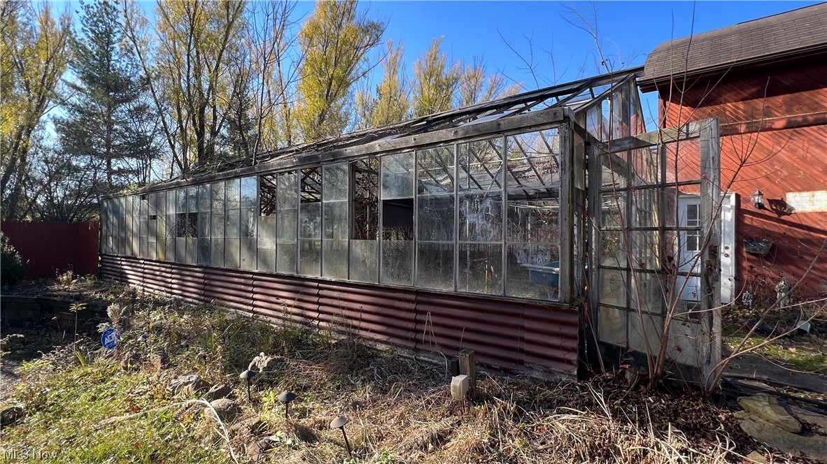1148 Ridge Road Hinckley, OH 44233 - Photo 26 of 33 Greenhouse adjacent to garage in need of repair