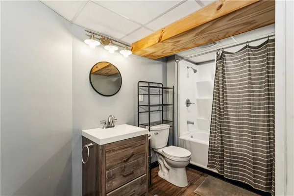 a bathroom with a toilet and a sink