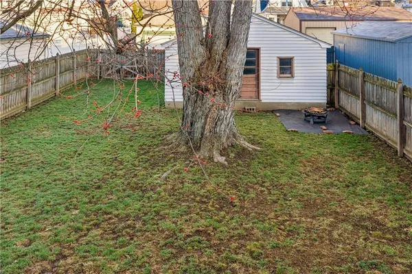 a backyard of a house with lots of green space