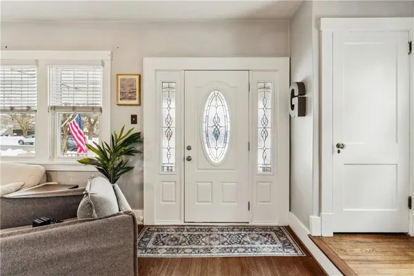 a view of entryway with wooden floor