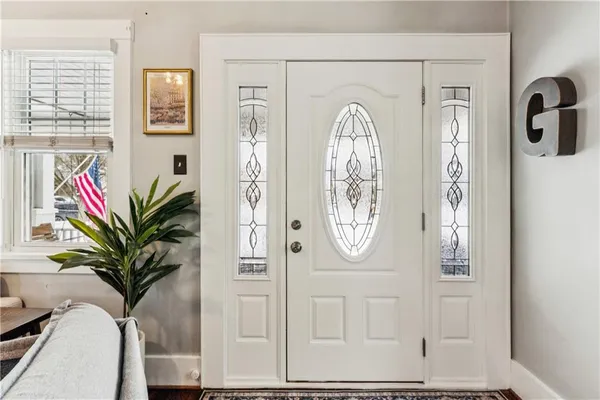 a view of a entryway with wooden floor