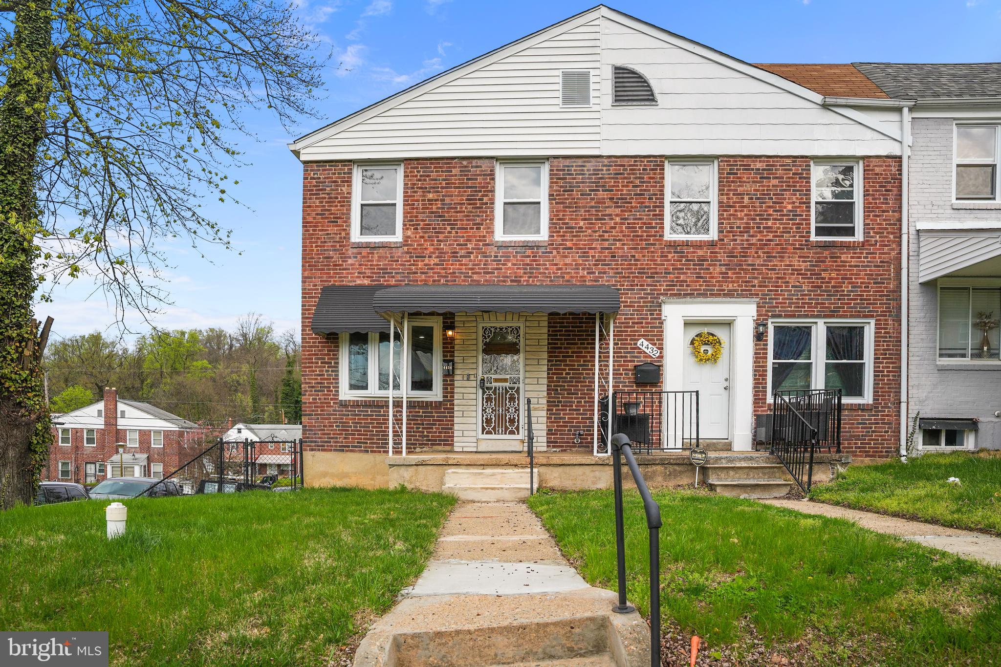 4434 Manorview Road Baltimore, MD 21229 - Photo 1 of 34 a front view of a house with a yard