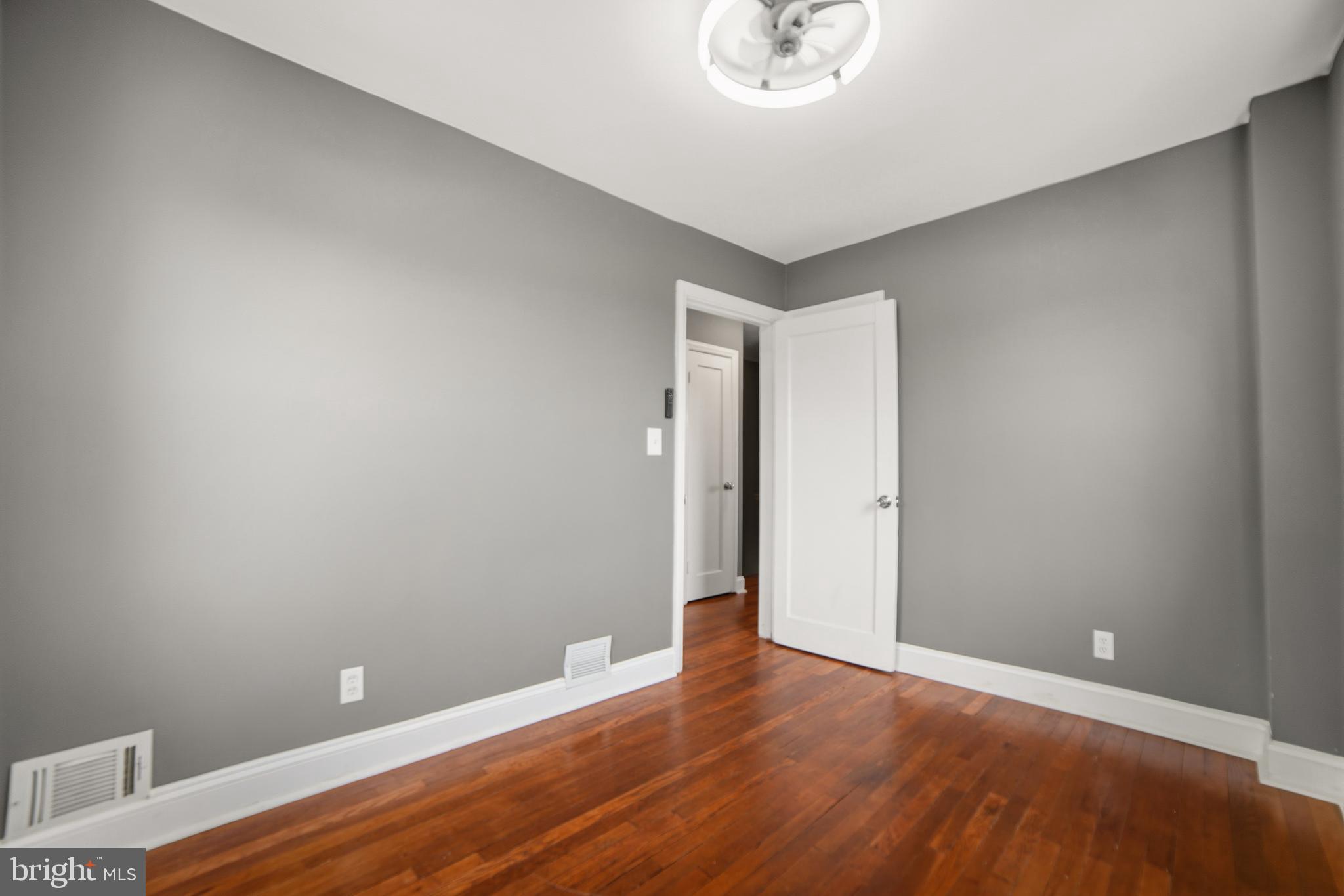 4434 Manorview Road Baltimore, MD 21229 - Photo 15 of 34 a view of an empty room with wooden floor