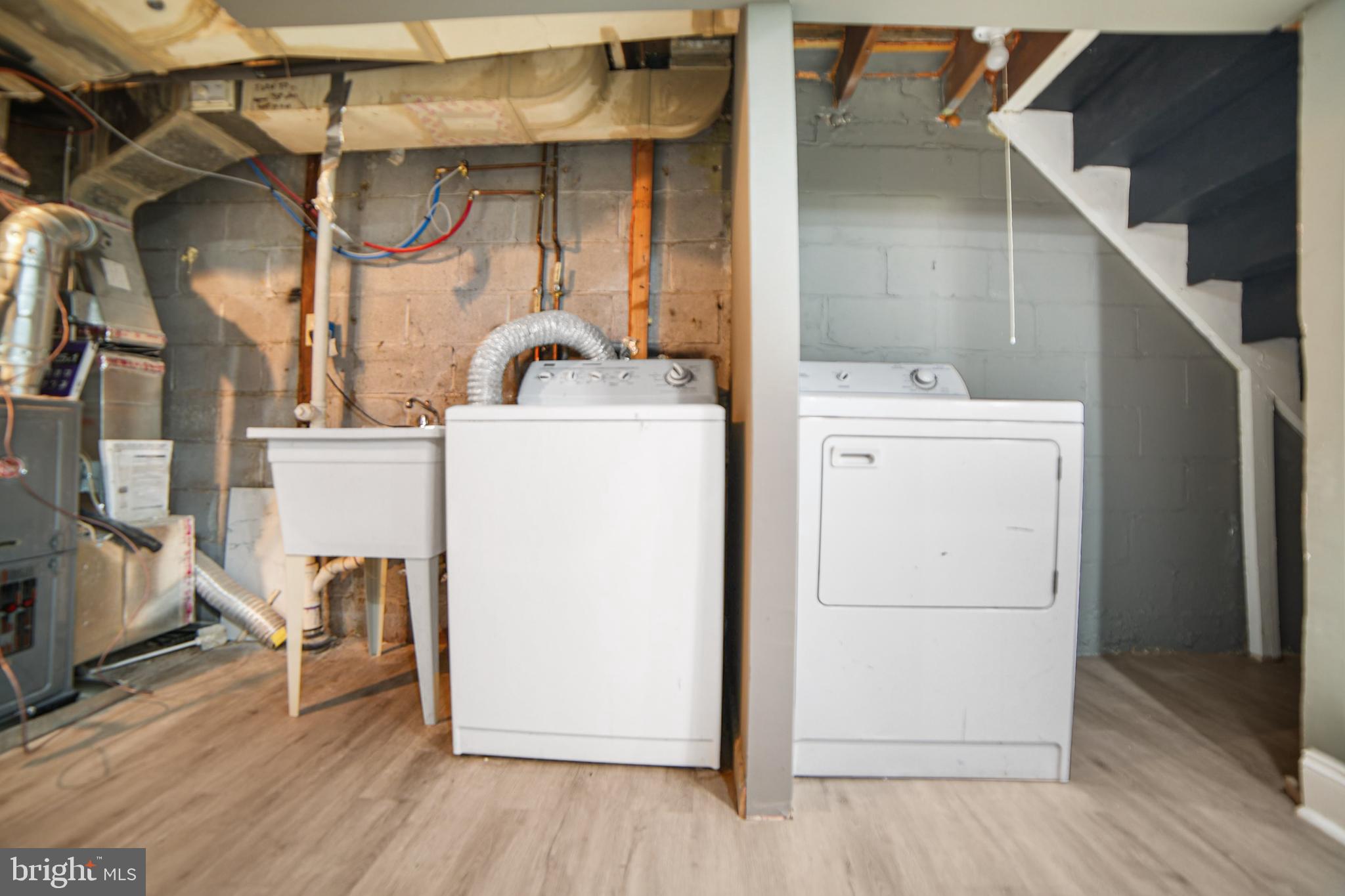 4434 Manorview Road Baltimore, MD 21229 - Photo 27 of 34 a view of storage and utility room with washer and dryer