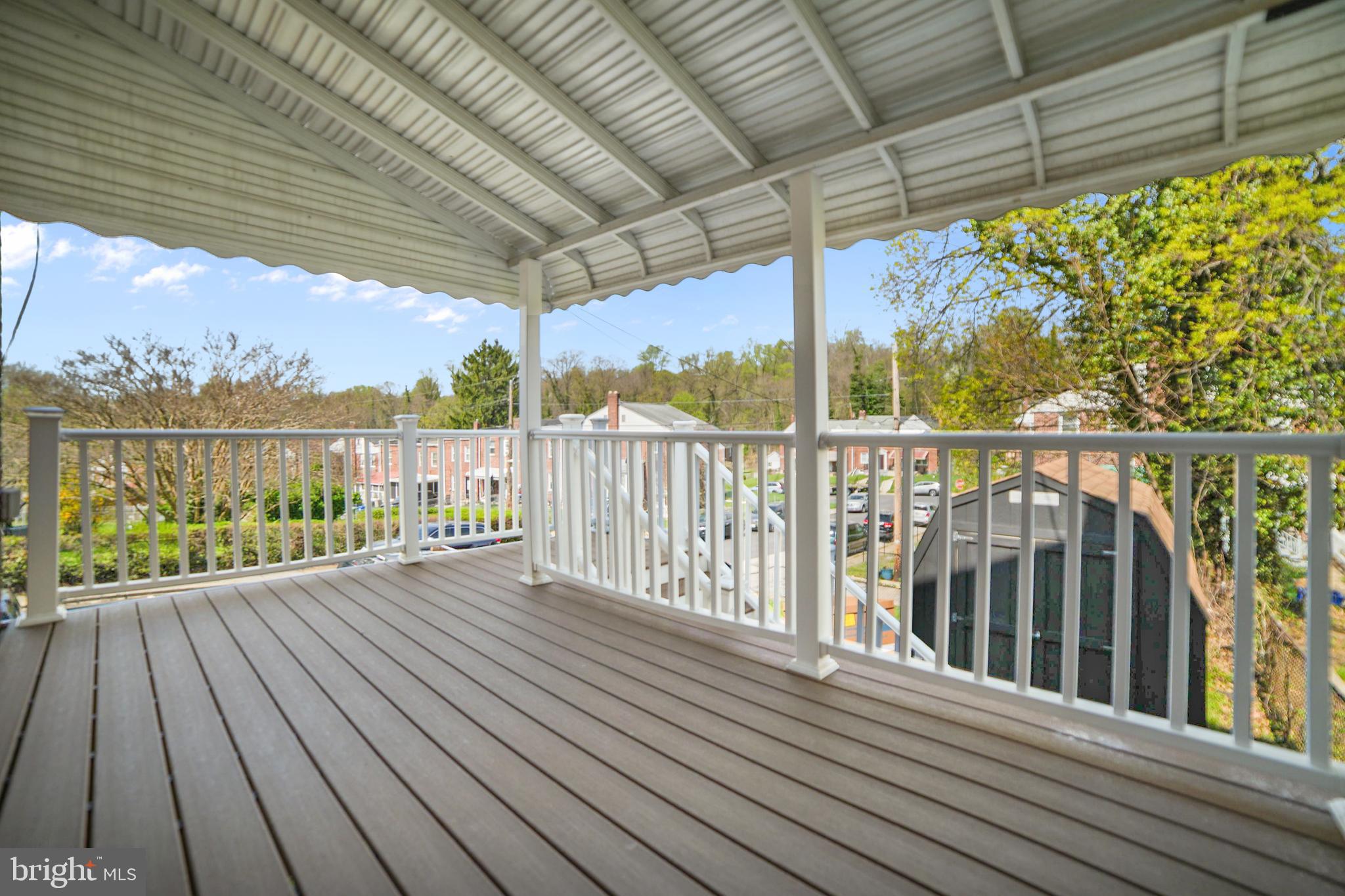 4434 Manorview Road Baltimore, MD 21229 - Photo 30 of 34 a view of a balcony with wooden floor