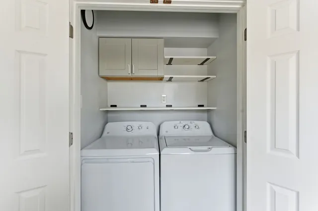 a utility room with dryer and washer