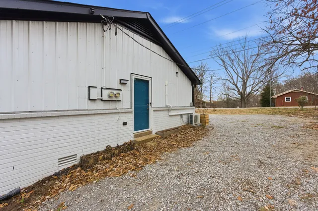 a view of a backyard of the house