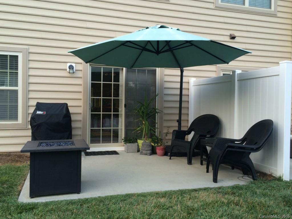 14713 Intermilan Way Charlotte, NC 28277 - Photo 15 of 16 a building outdoor space with patio furniture and a umbrella