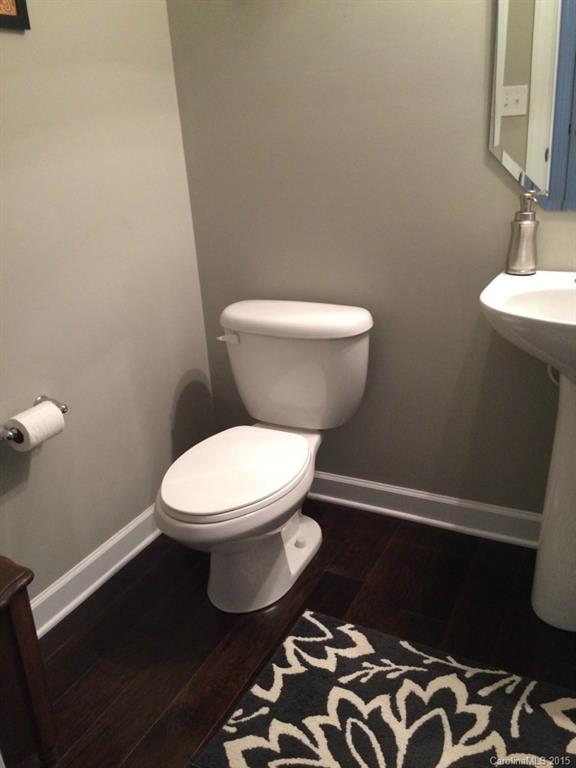 14713 Intermilan Way Charlotte, NC 28277 - Photo 8 of 16 a white toilet sitting next to a bathroom sink