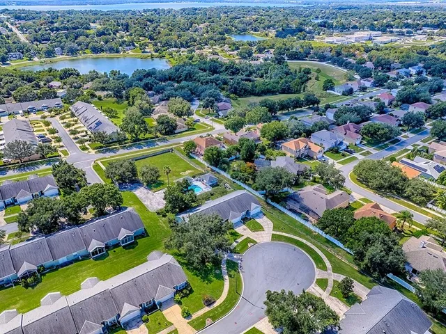 an aerial view of a houses and an outdoor space