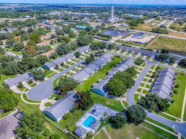 an aerial view of residential houses with outdoor space