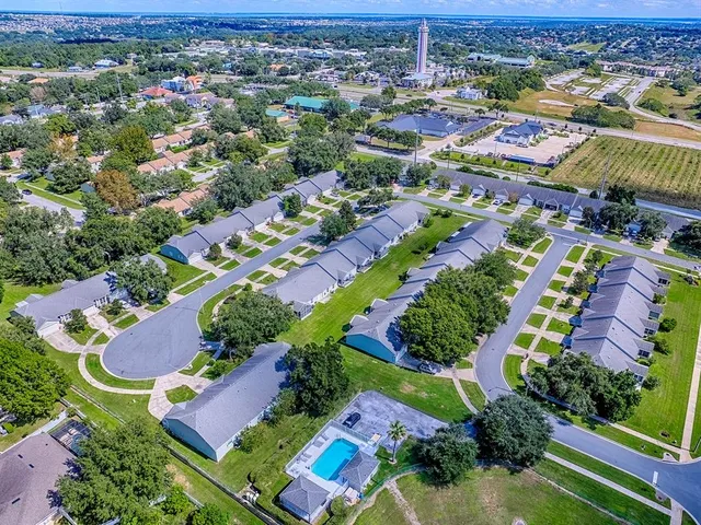 an aerial view of residential houses with outdoor space