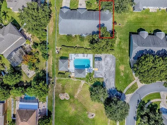 an aerial view of a house with a garden