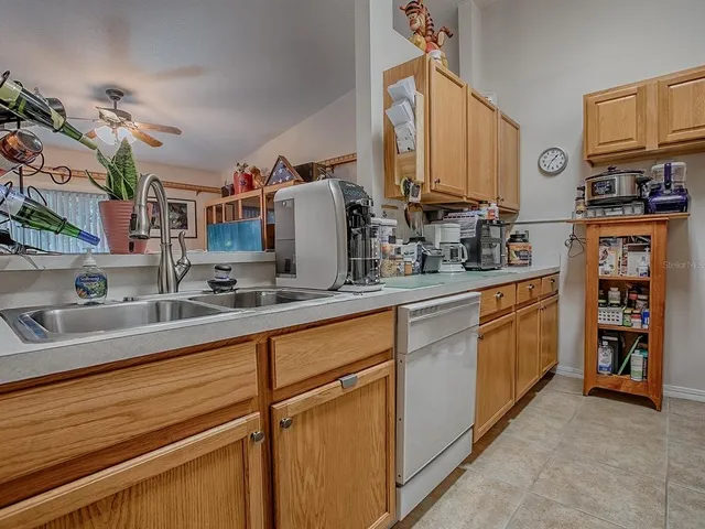 a kitchen with sink and cabinets