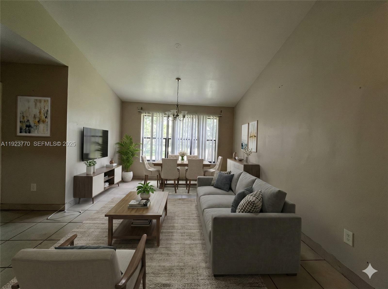 4201 West McNab Road, Unit 15 Pompano Beach, FL 33069 - Photo 11 of 18 a living room with furniture and a large window