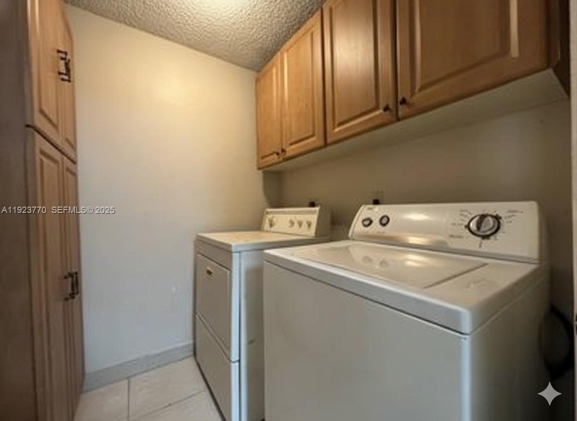 4201 West McNab Road, Unit 15 Pompano Beach, FL 33069 - Photo 17 of 18 a utility room with dryer and washer