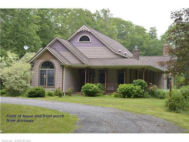 672 Pudding Hill Road Hampton, CT 06247 - Photo 1 of 1 a front view of a house with garden
