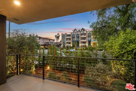 a view of a balcony with city view