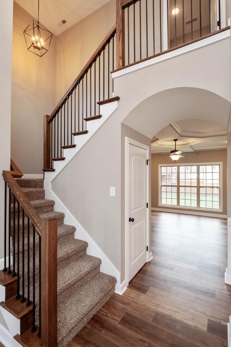 2459 Shadowood Road Clarksville, TN 37043 - Photo 1 of 15 a view of staircase with lots of frames and wooden floor