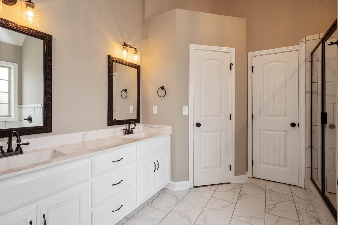 2459 Shadowood Road Clarksville, TN 37043 - Photo 11 of 15 a bathroom with a double vanity sink mirror and