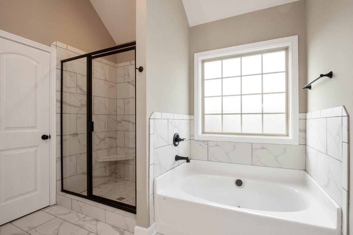 2459 Shadowood Road Clarksville, TN 37043 - Photo 12 of 15 a bathroom with a bathtub and shower