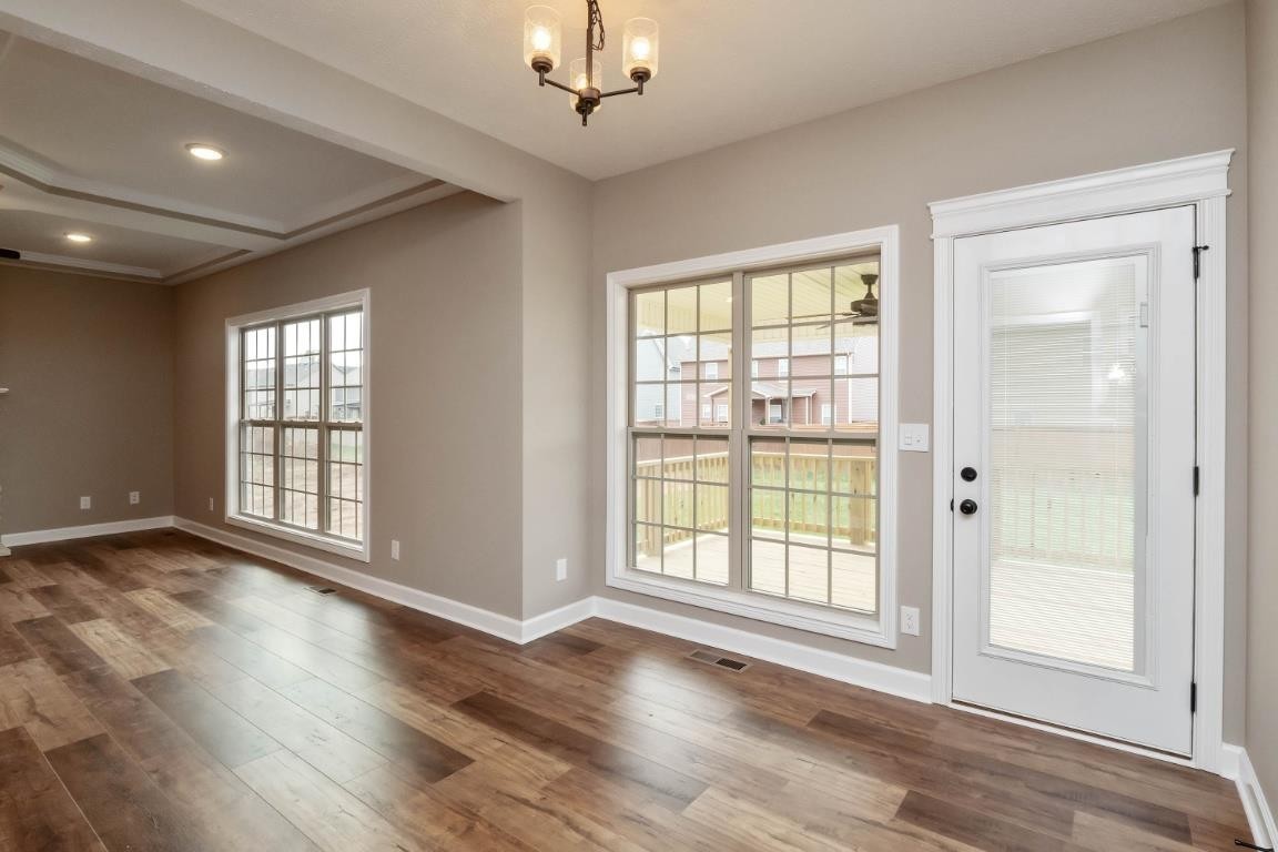 2459 Shadowood Road Clarksville, TN 37043 - Photo 6 of 15 an empty room with wooden floor and windows