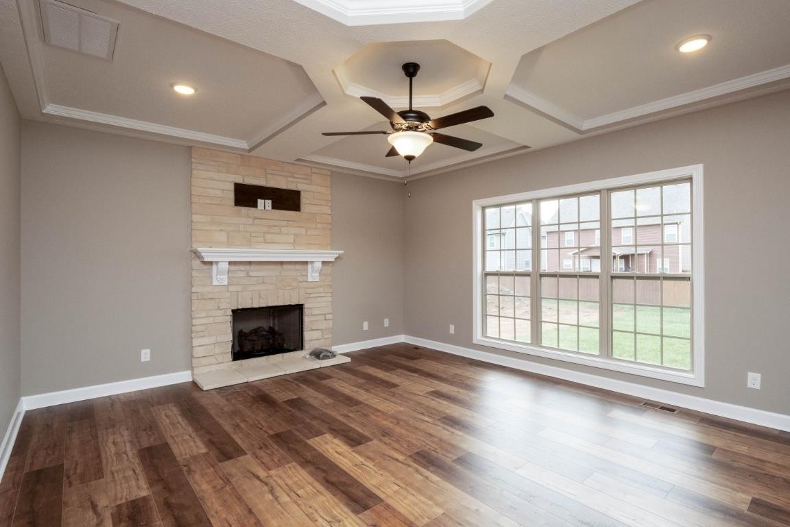 2459 Shadowood Road Clarksville, TN 37043 - Photo 7 of 15 wooden floor fireplace and windows in a room