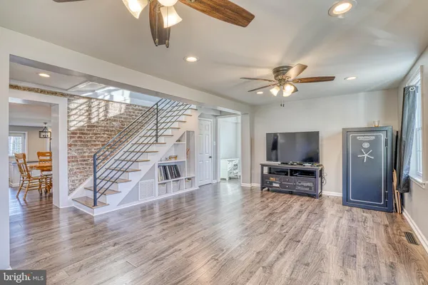 a view of livingroom with furniture flat screen tv and wooden floor