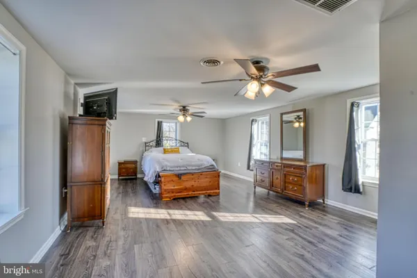 a bedroom with bed and window