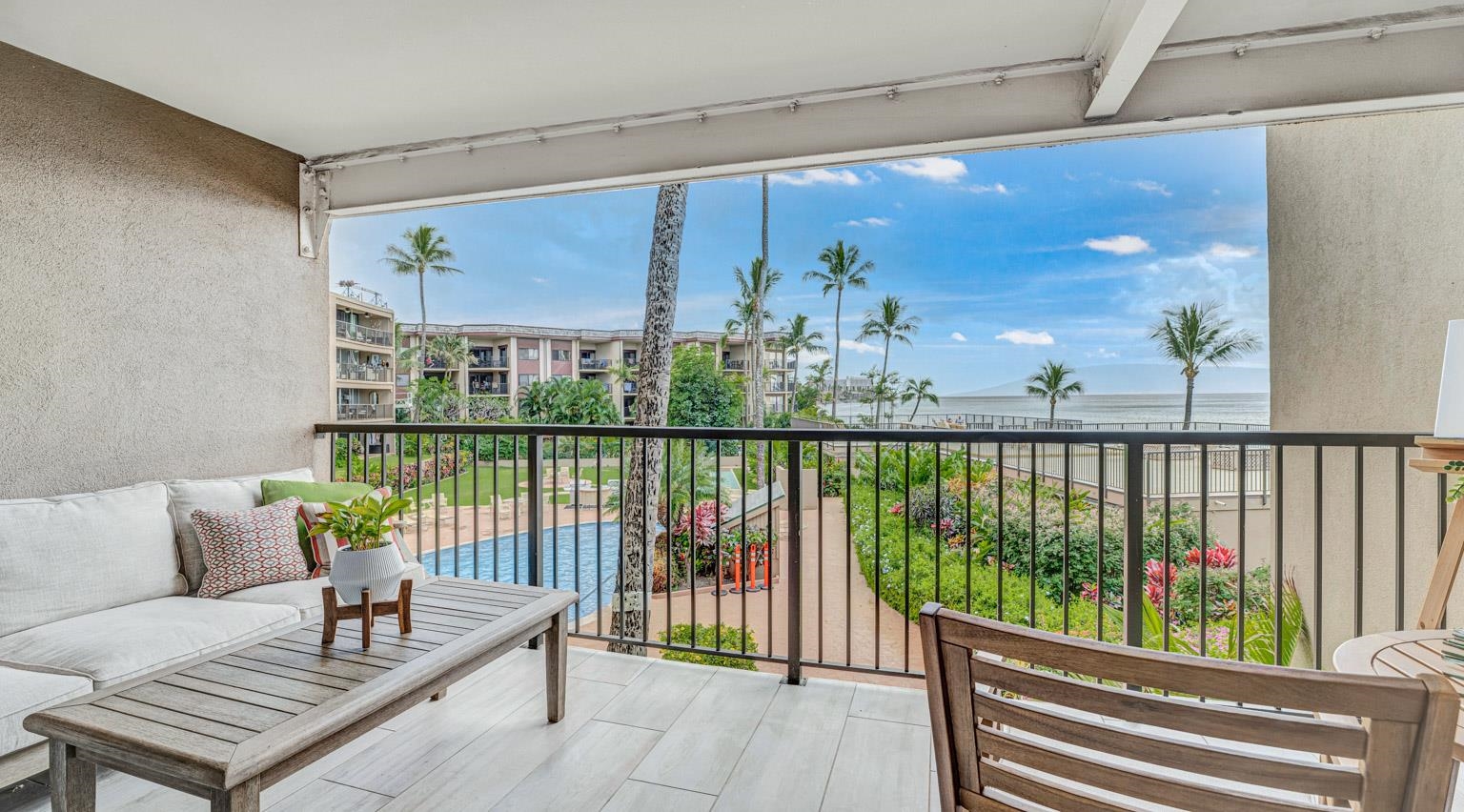 a balcony with furniture and wooden floor