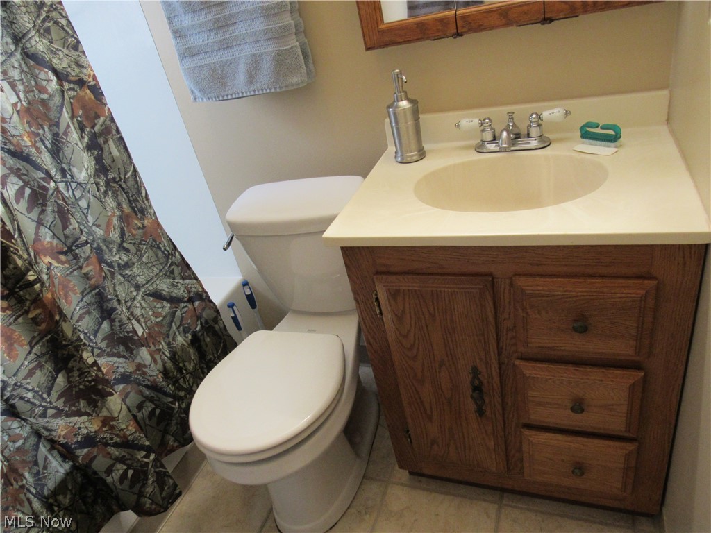 4836 Forest Road Mentor, OH 44060 - Photo 17 of 31 Neutral flooring, toilet & bathroom cabinet for storage!