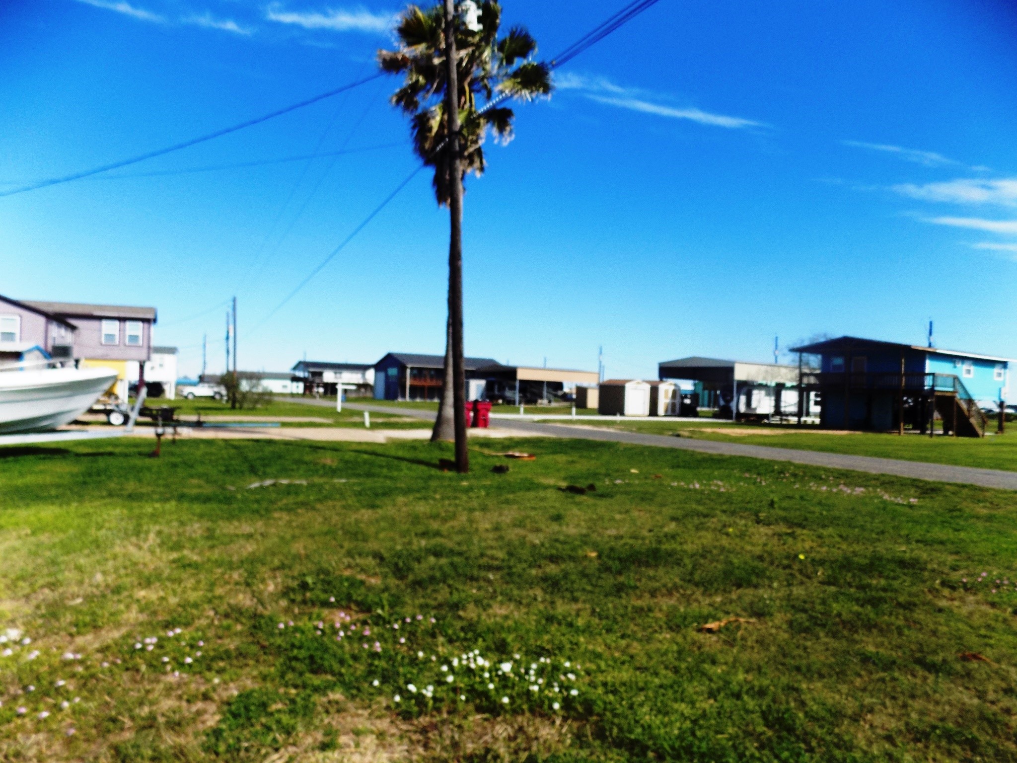 616 Seagull Road Sargent, TX 77414 - Photo 4 of 7 a view of a house with a backyard