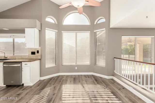 a kitchen with a sink stainless steel appliances and cabinets
