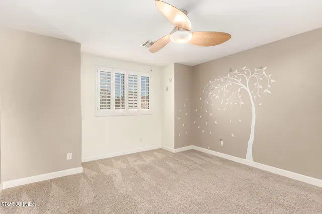 a view of a chandelier fan and entryway