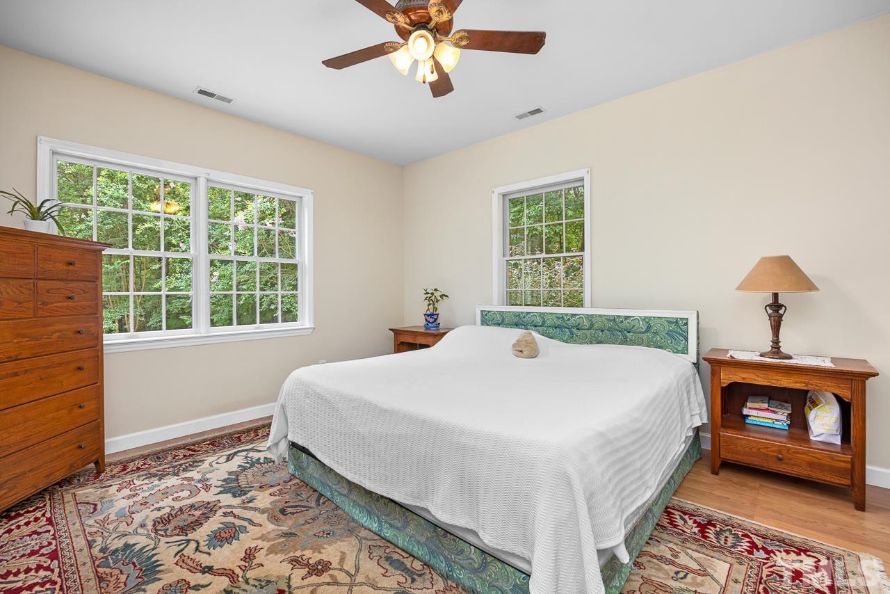 1008 Windstar Way Willow Spring, NC 27592 - Photo 17 of 51 a bedroom with a bed and a window