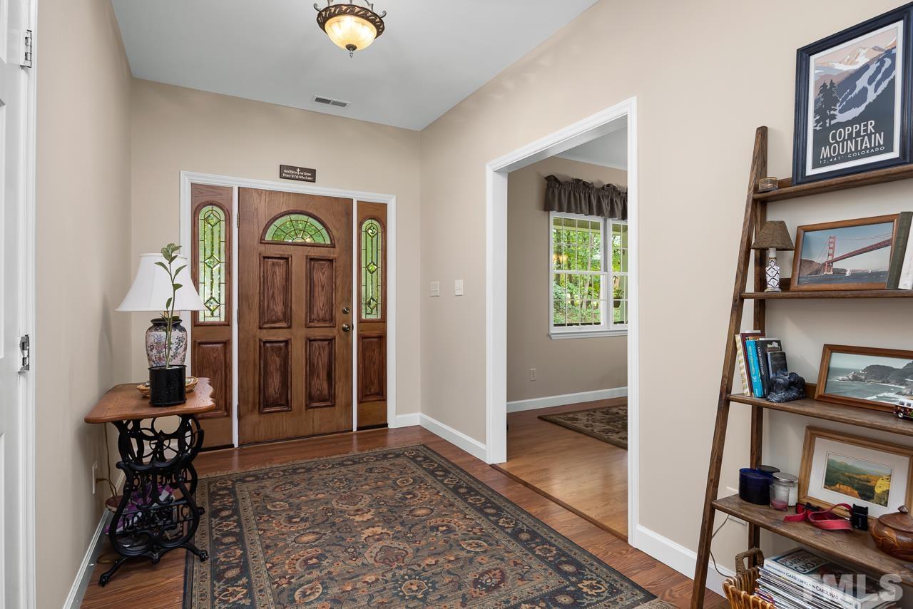 1008 Windstar Way Willow Spring, NC 27592 - Photo 2 of 51 a view of hallway with window and furniture