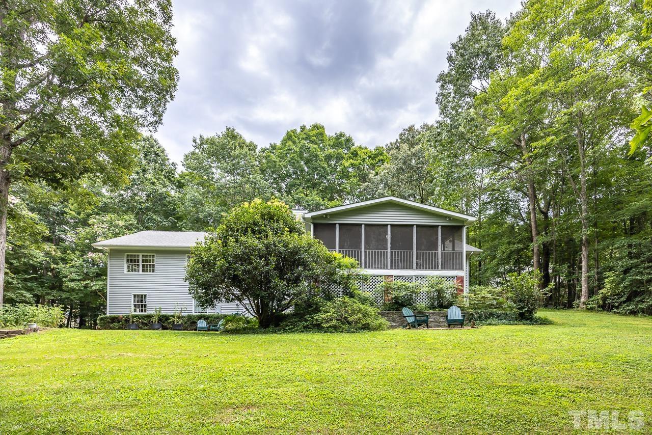 1008 Windstar Way Willow Spring, NC 27592 - Photo 30 of 51 a front view of a house with a garden