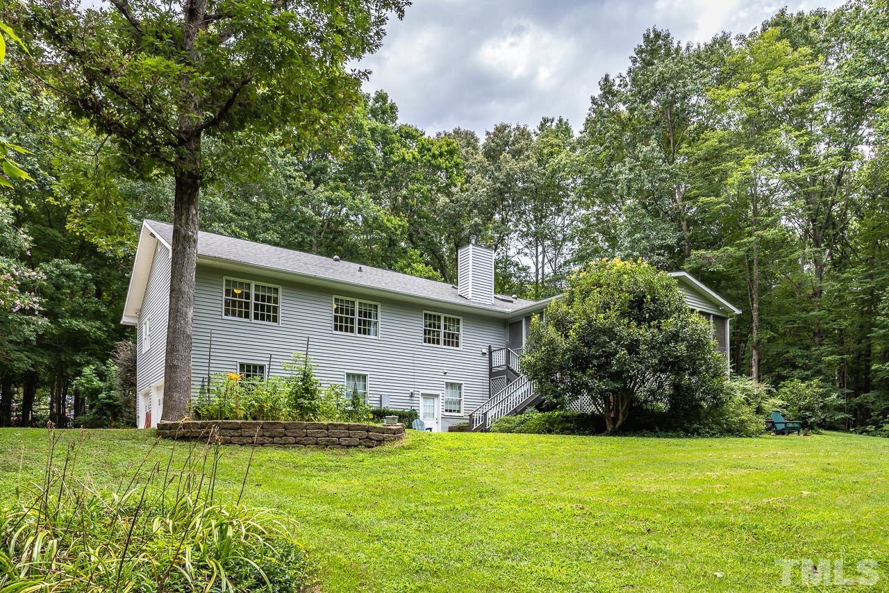 1008 Windstar Way Willow Spring, NC 27592 - Photo 33 of 51 a view of a house with backyard and garden
