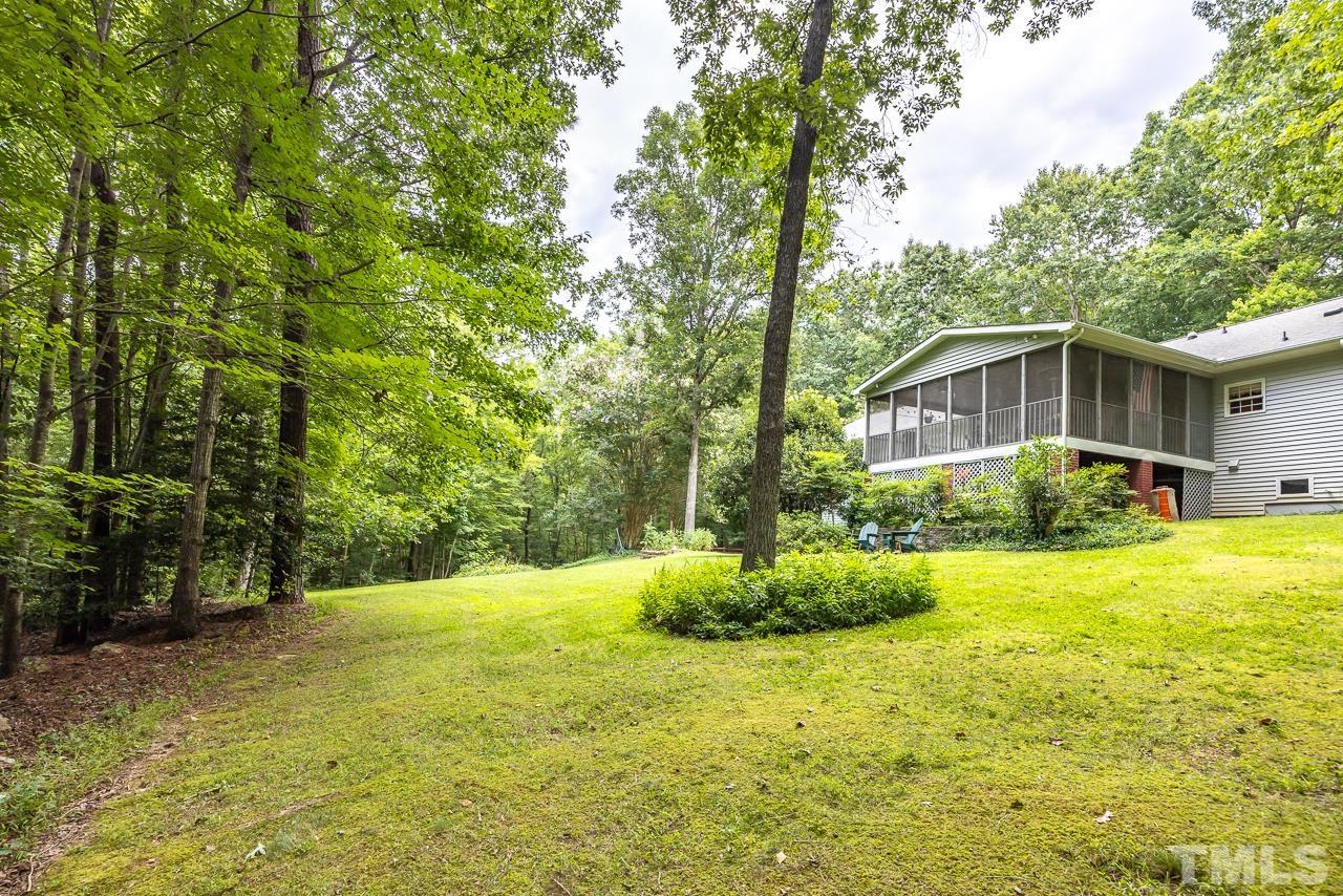 1008 Windstar Way Willow Spring, NC 27592 - Photo 36 of 51 a front view of house with yard and trees