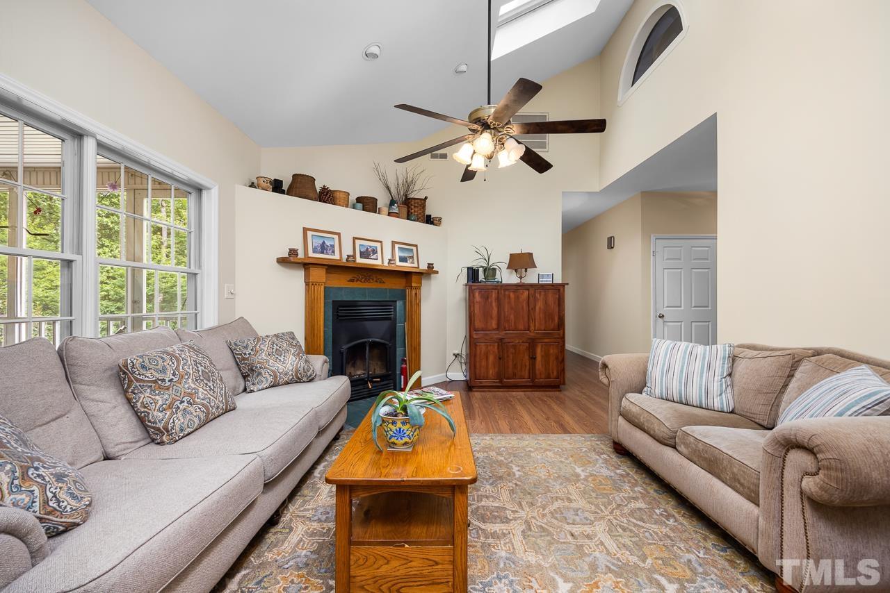 1008 Windstar Way Willow Spring, NC 27592 - Photo 4 of 51 a living room with furniture and a fireplace