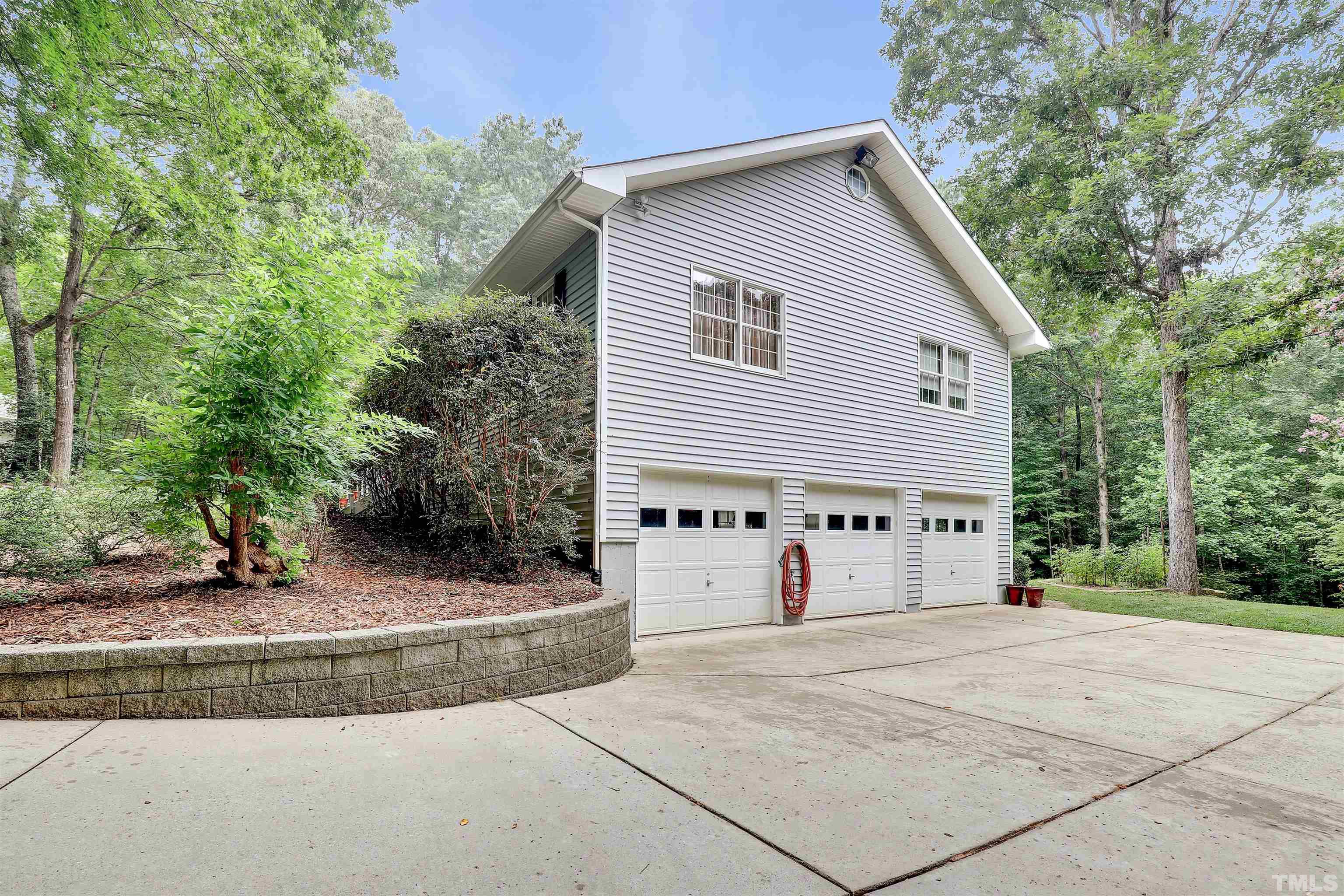 1008 Windstar Way Willow Spring, NC 27592 - Photo 47 of 51 a view of a house with backyard and trees